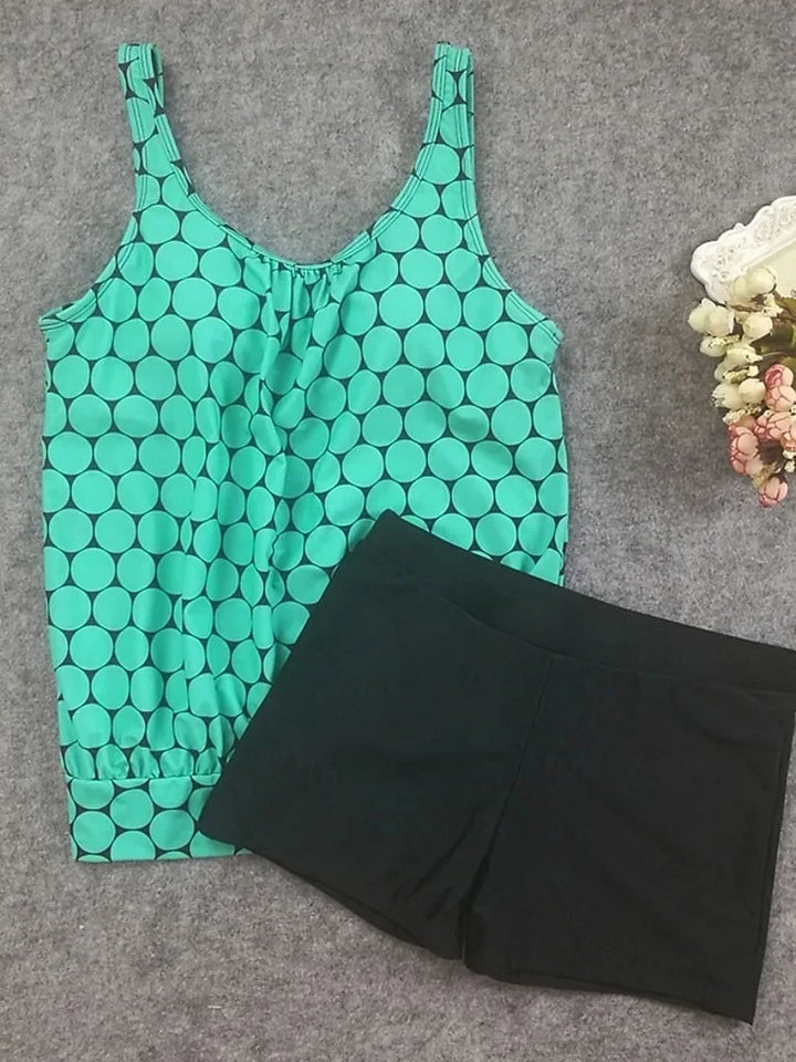 Punto | Completo tankini a pois che copre la pancia con shorts mare
